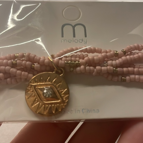 Super cute pink stretchy bracelet with gold charms. - Picture 4 of 4